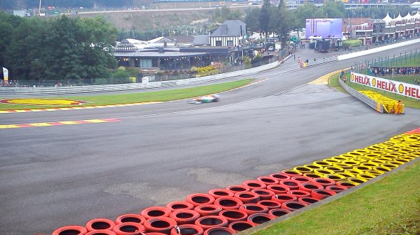 Drivers cautious through a damp Eau Rouge